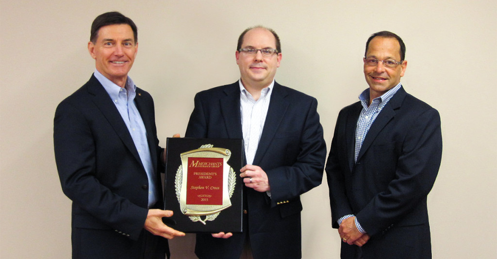Bob Zak (left) and Pete Balisteri (right) present Steve Cross (center) the 2015 President's Award.
