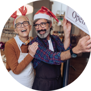 couple in christmas holiday attire at small business