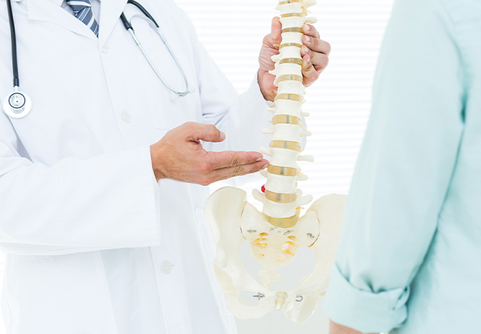 chiropractor working with patient