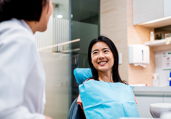 Dental hygienist working with patient