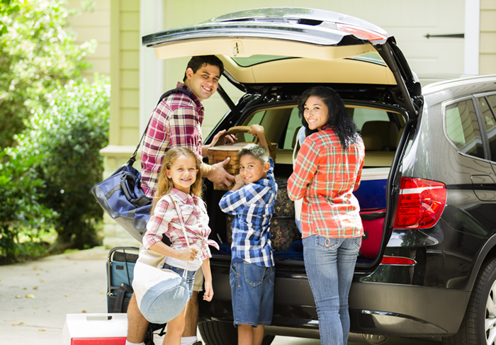 Family packing a car