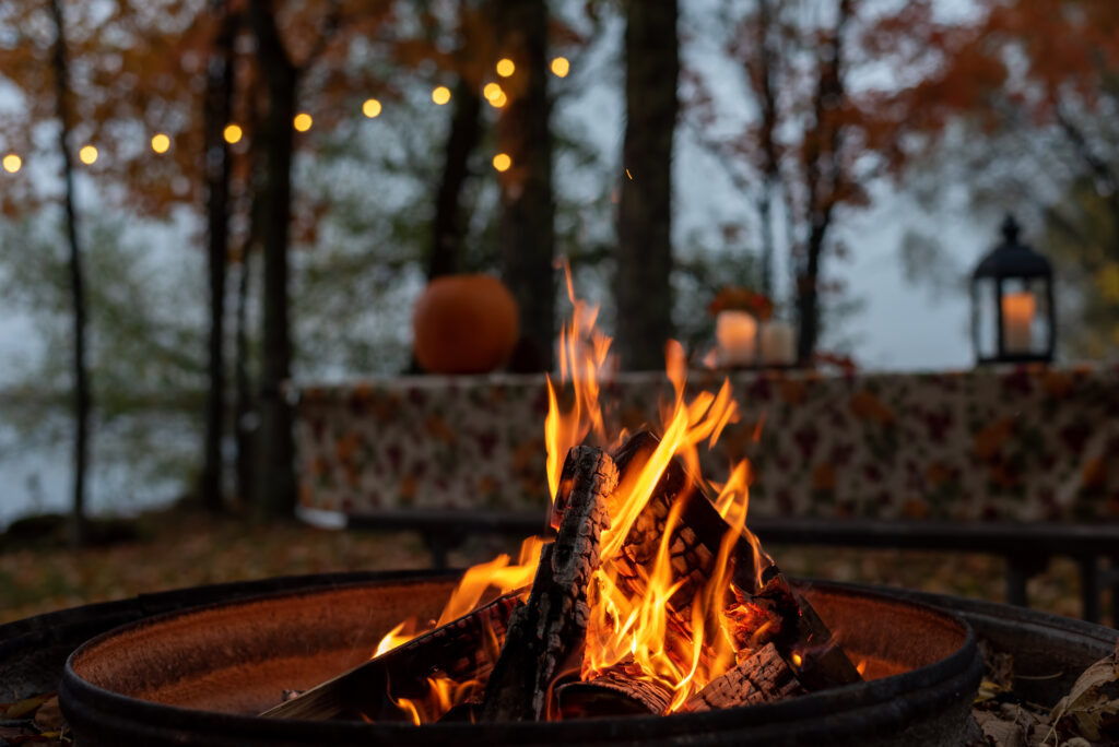 Closeup of glowing outdoor fire pit in fall