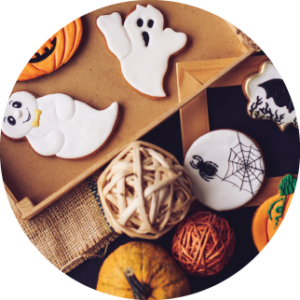 halloween cookies and decorations on table, preparing for halloween business season