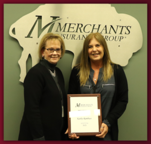 Merchants' Kelly Julius and Kathy Rambuss pose with President's Award plaque