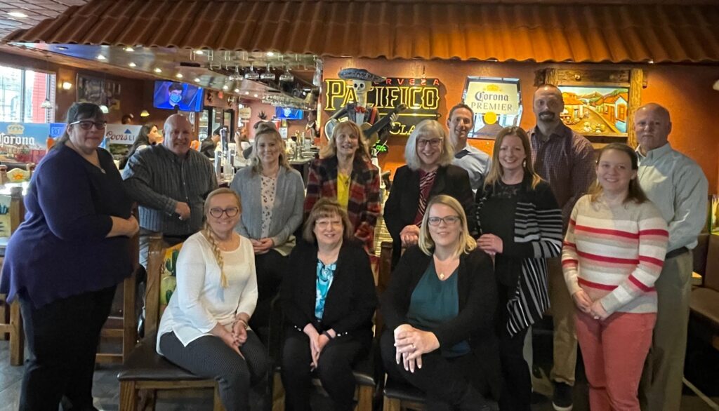 Group photo of Fortified Insurance Agency, Merchants' Agent of the Year, with Merchants colleagues