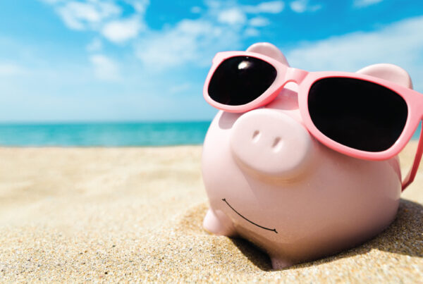 piggy bank on the beach in summer; boosting business