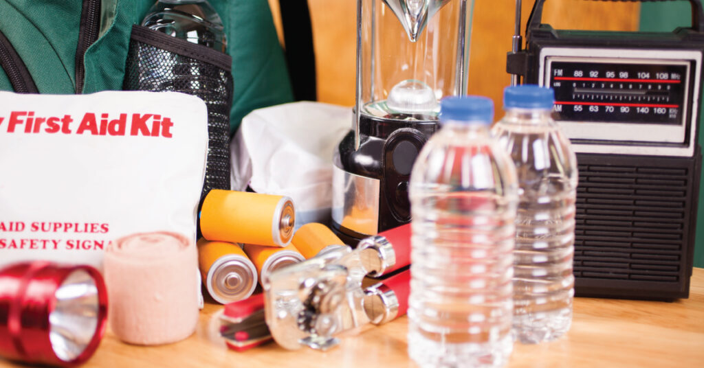 supplies for hurricane preparedness kit, water bottles, first aid kid, lantern, other supplies for community to prepare