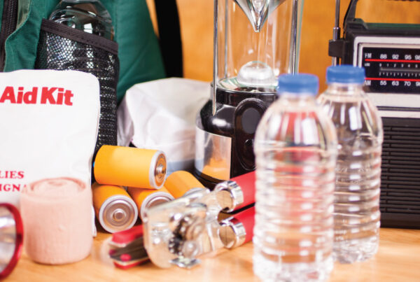 supplies for hurricane preparedness kit, water bottles, first aid kid, lantern, other supplies for community to prepare