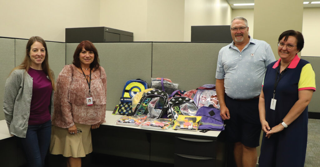 Merchants Insurance Group colleagues with donations to Assured Partners school supply drive