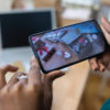 Photo of. person's hand taking a picture of Valentine's Day products, as suggested in Valentine's Day marketing tips