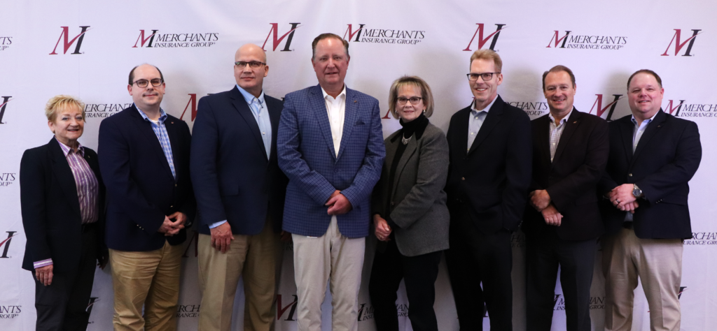 Leadership team at Merchants Insurance Group poses together