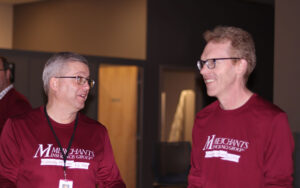 Scott Behrent and Ben Walden converse at Merchants' 105th anniversary celebration