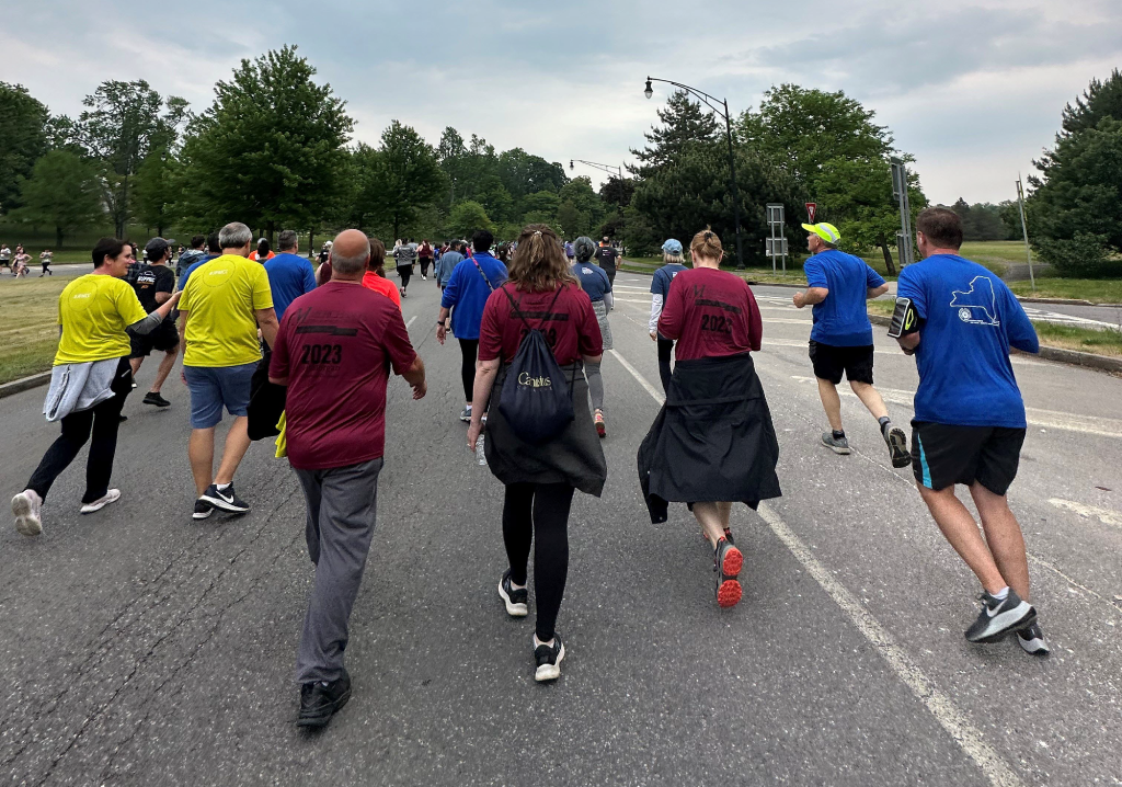 Merchants colleagues Rob Ader, Katherine Trautwein, and Laurie Maniccia walk in the Corporate Challenge