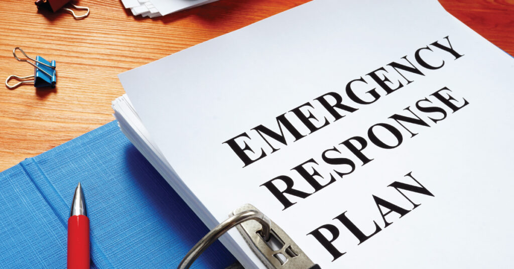 binder with "Emergency Response Plan" on desk