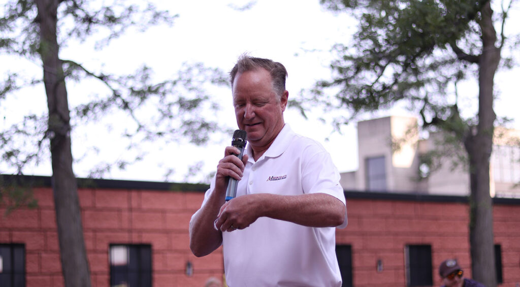 Charles Makey, President of Merchants Insurance Group, reads the name of one lucky raffle winner!