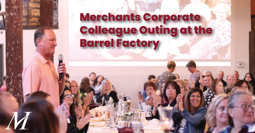 Text reads "Merchants Corporate Colleague Outing at the Barrel Factory" on group photo of Merchants colleagues