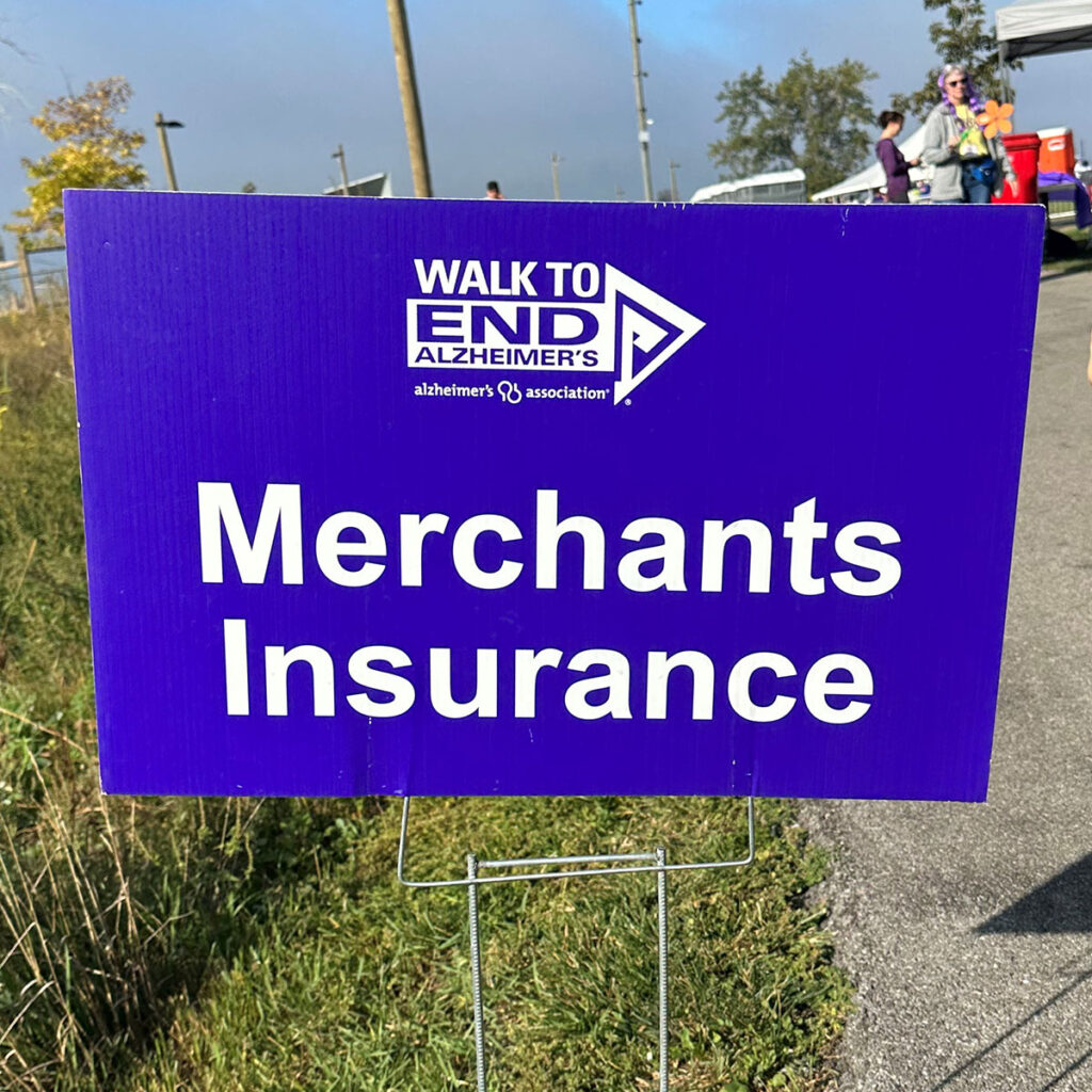 Walk to End Alzheimer's sponsorship sign reads "Merchants Insurance"