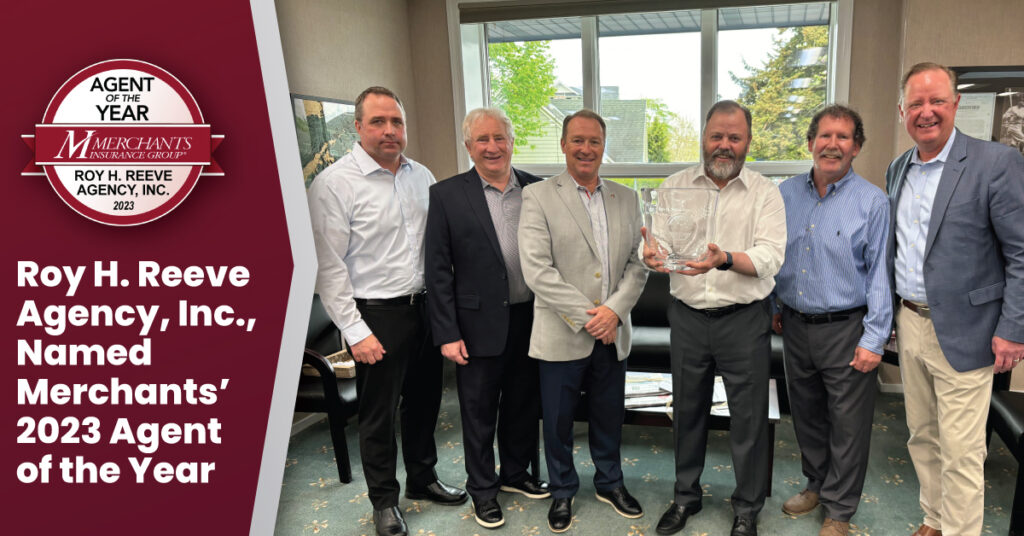 Group photo of leaders from Roy H. Reeve Agency Inc. and Merchants Insurance Group with the Agent of the Year 2023 award; text reads "Roy H. Reeve Agency, Inc., Named Merchants' 2023 Agent of the Year" with Merchants' Agent of the Year badge