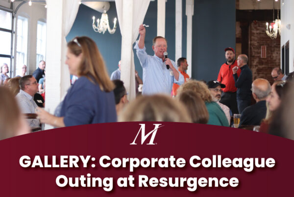 Merchants Insurance Group President and CEO Charles Makey raffles off prizes to corporate colleagues at the annual Colleague Outing at Resurgence in Buffalo, NY. Text reads "GALLERY: Corporate Colleague Outing at Resurgence"