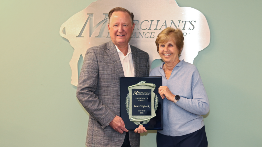 Charles Makey, President & CEO of Merchants Insurance Group, and Janice Wojtanik, Executive Assistant and 2025 President's Award recipient