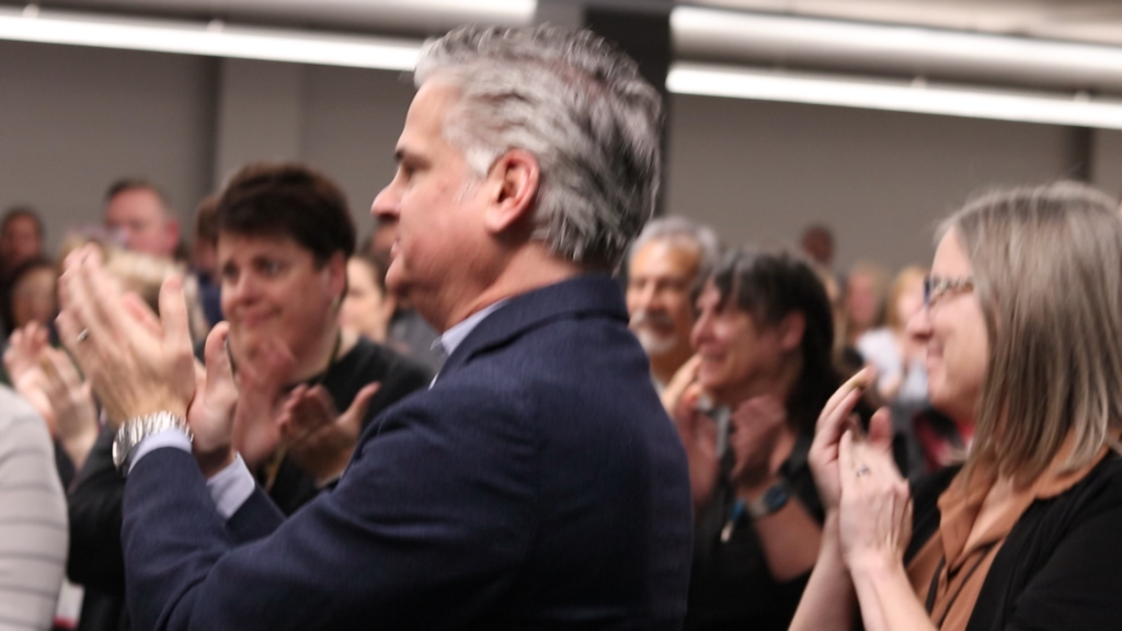 Merchants colleagues cheer as Janice Wojtanik is announced as the company's 2025 President's Award recipient