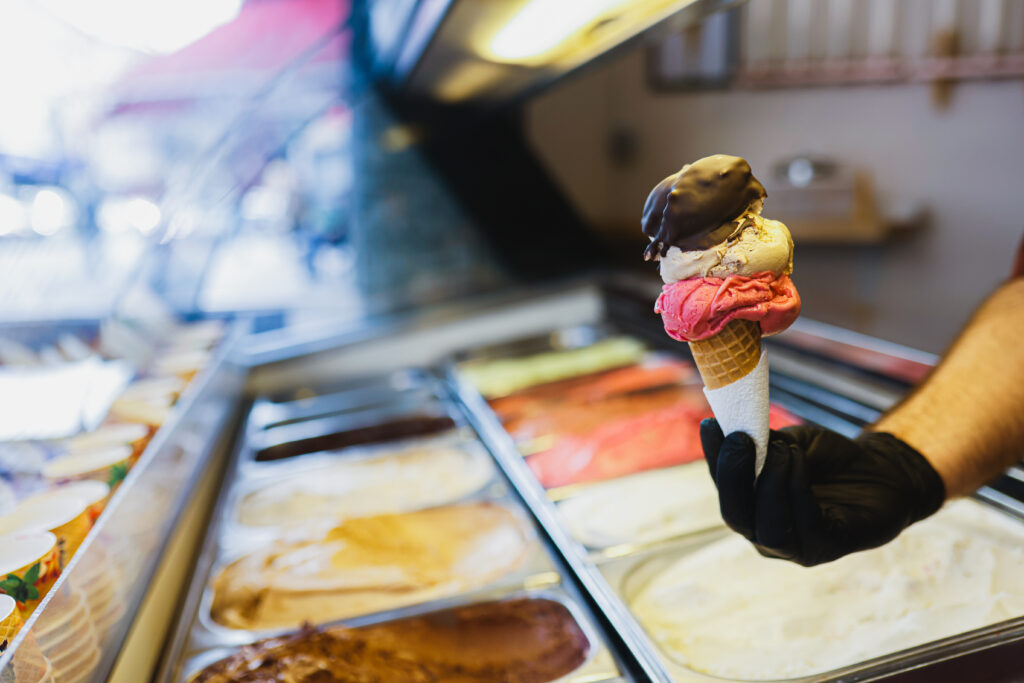 Ice Cream Vendor and a Colorful Display of Flavors Stock photo