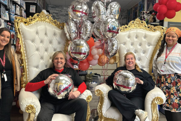 Merchants Insurance Group colleagues Erica Kellogg and Kyra-Jade Bogdan with Balloon Masters co-owners Chris and Marlene Potts