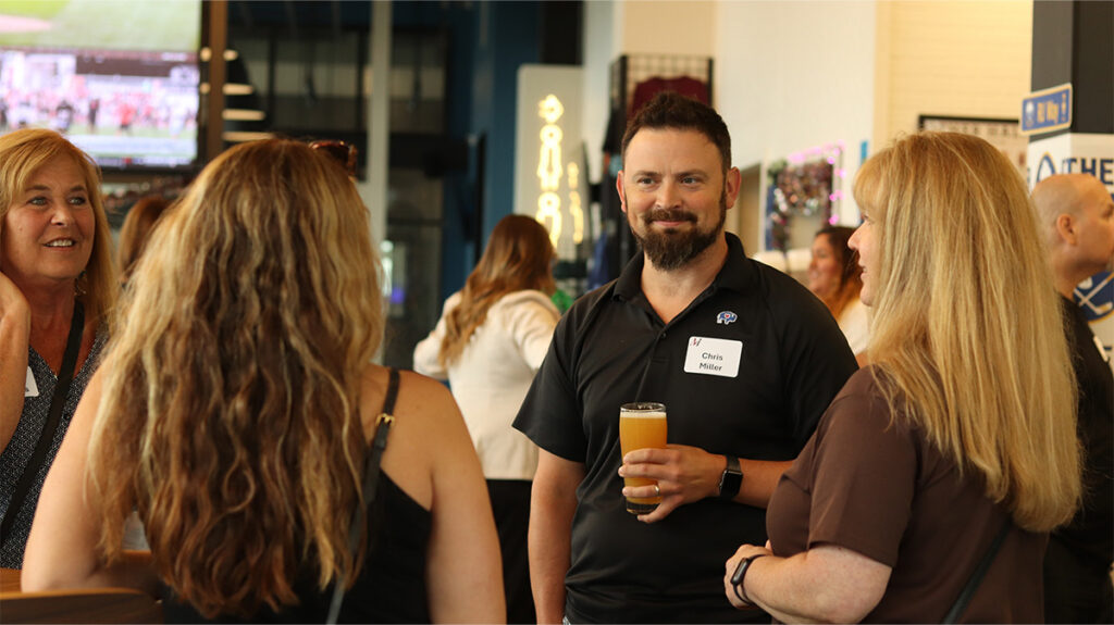 Merchants colleagues chatting at the 2026 Colleague Social