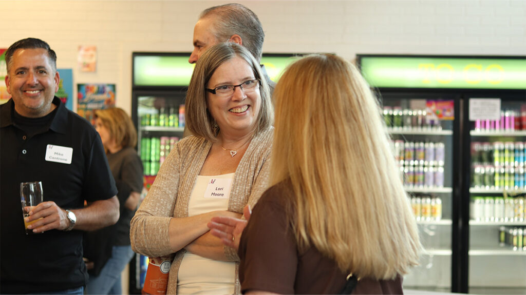 Merchants colleagues chatting at the 2026 Colleague Social