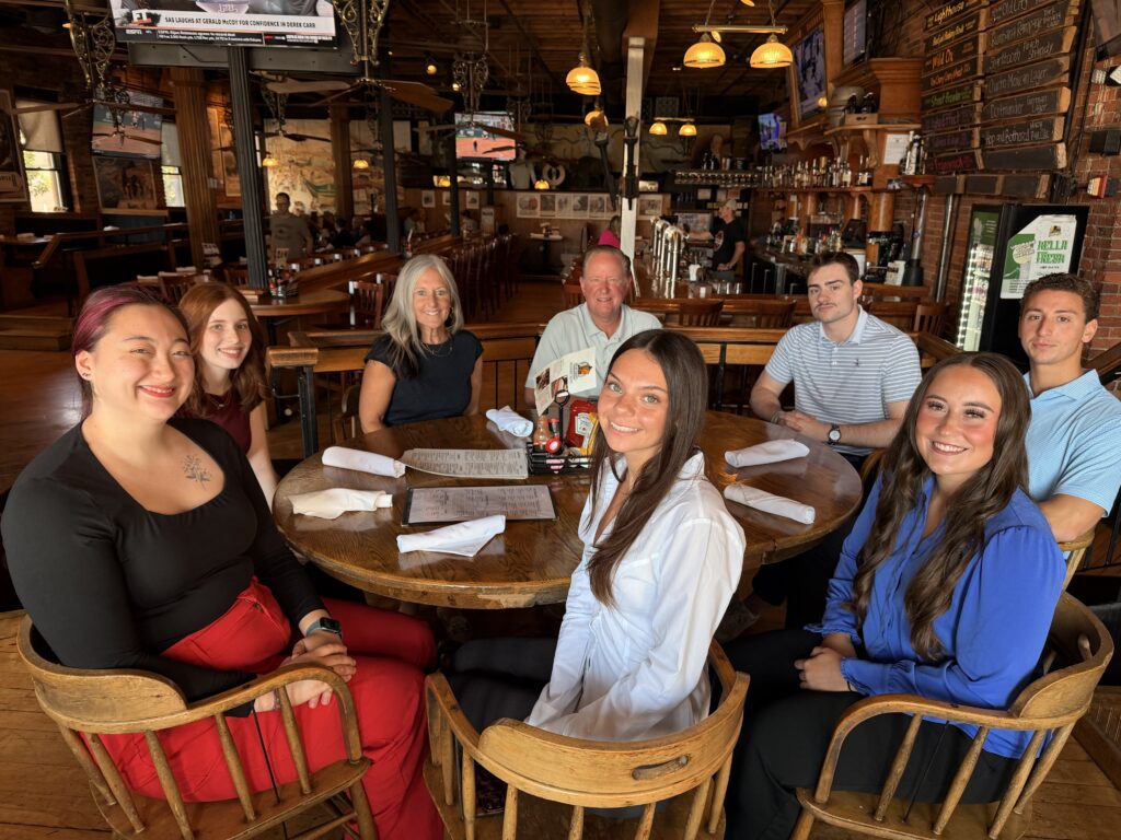 Merchants' 2026 summer interns at Pearl Street for lunch with Charles Makey and Laurie Brinkerhoff